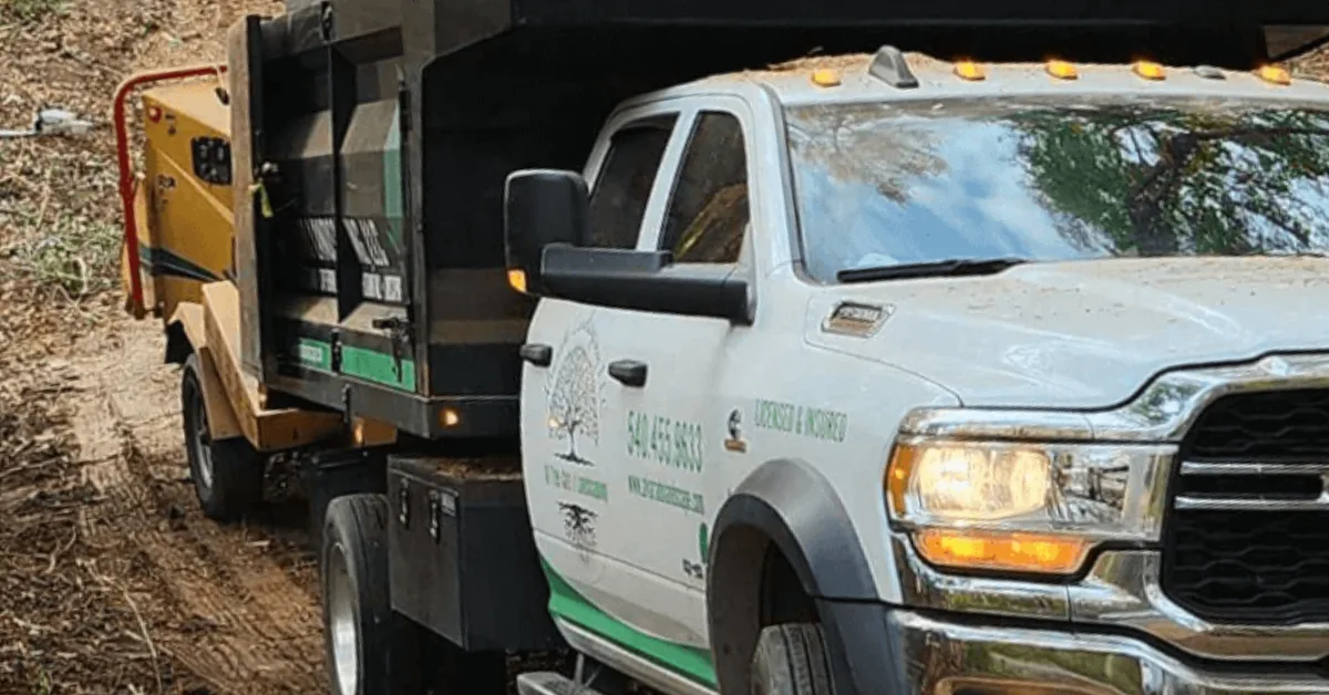 Alvarado Landscaping equipment clearing overgrown land in Fredericksburg, Virginia
